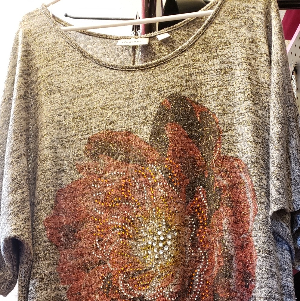 Sparkly Gray  Blouse with a flower on the front.